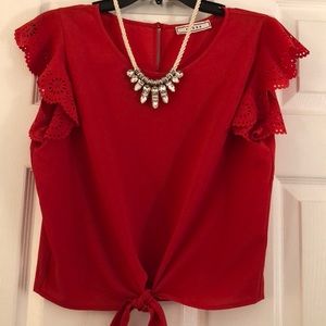 Red blouse with tie in front